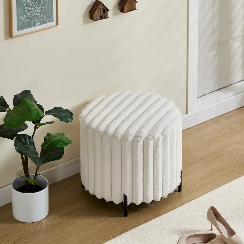 Pouf rond tapissé